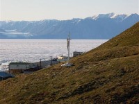 The cross erected by Fr. Etienne Bazin OMI on top of the hill facing west. The cross is watching over the very first part of the settlement of Pond Inlet.